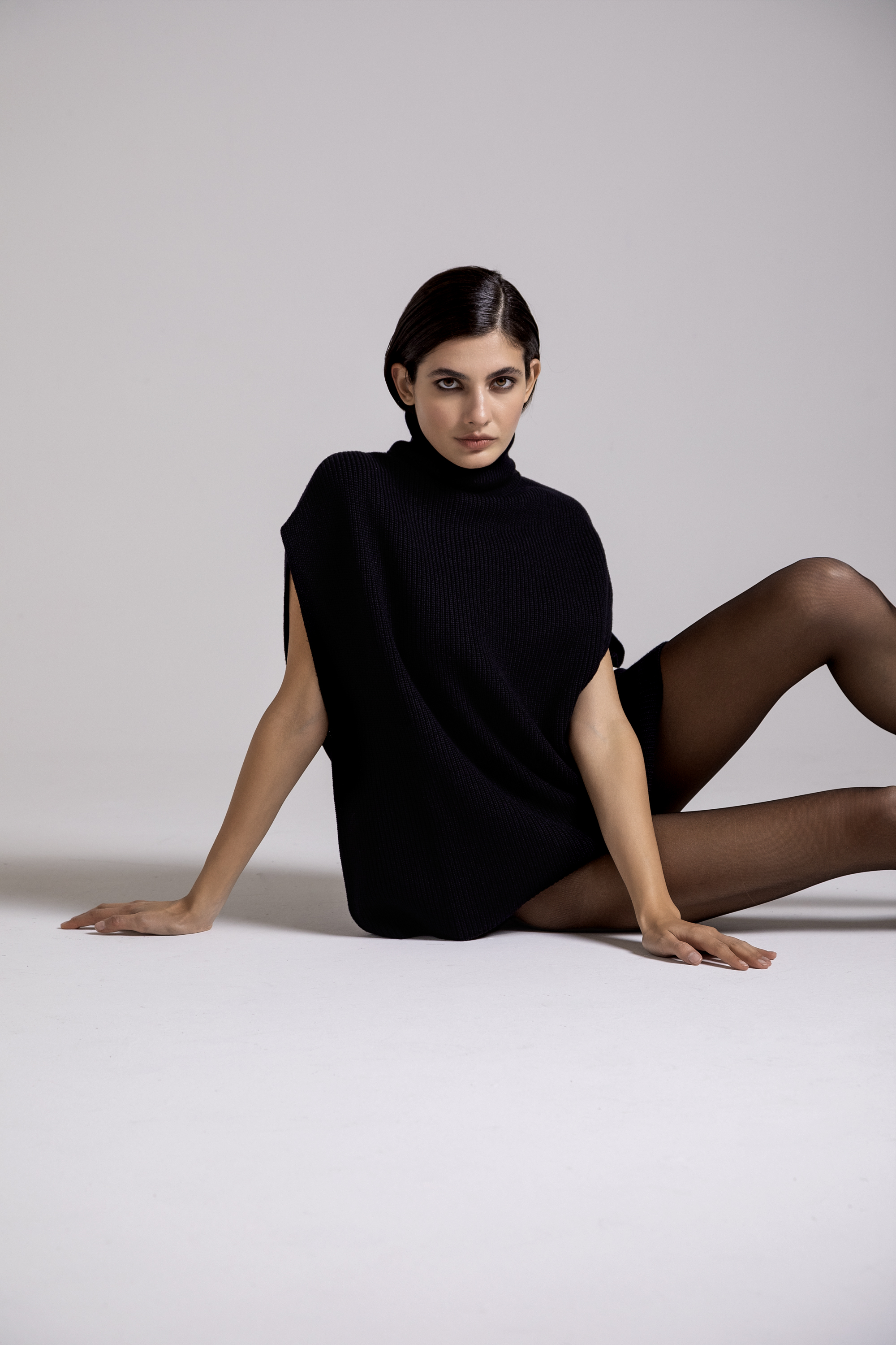 Sleeveless high neck wool poncho